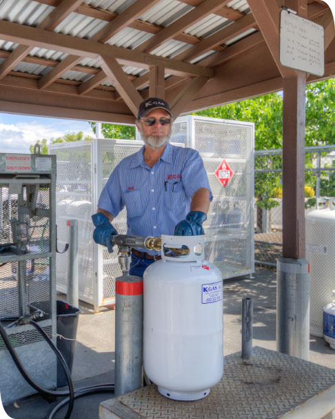 Long time employee refilling a propane tank